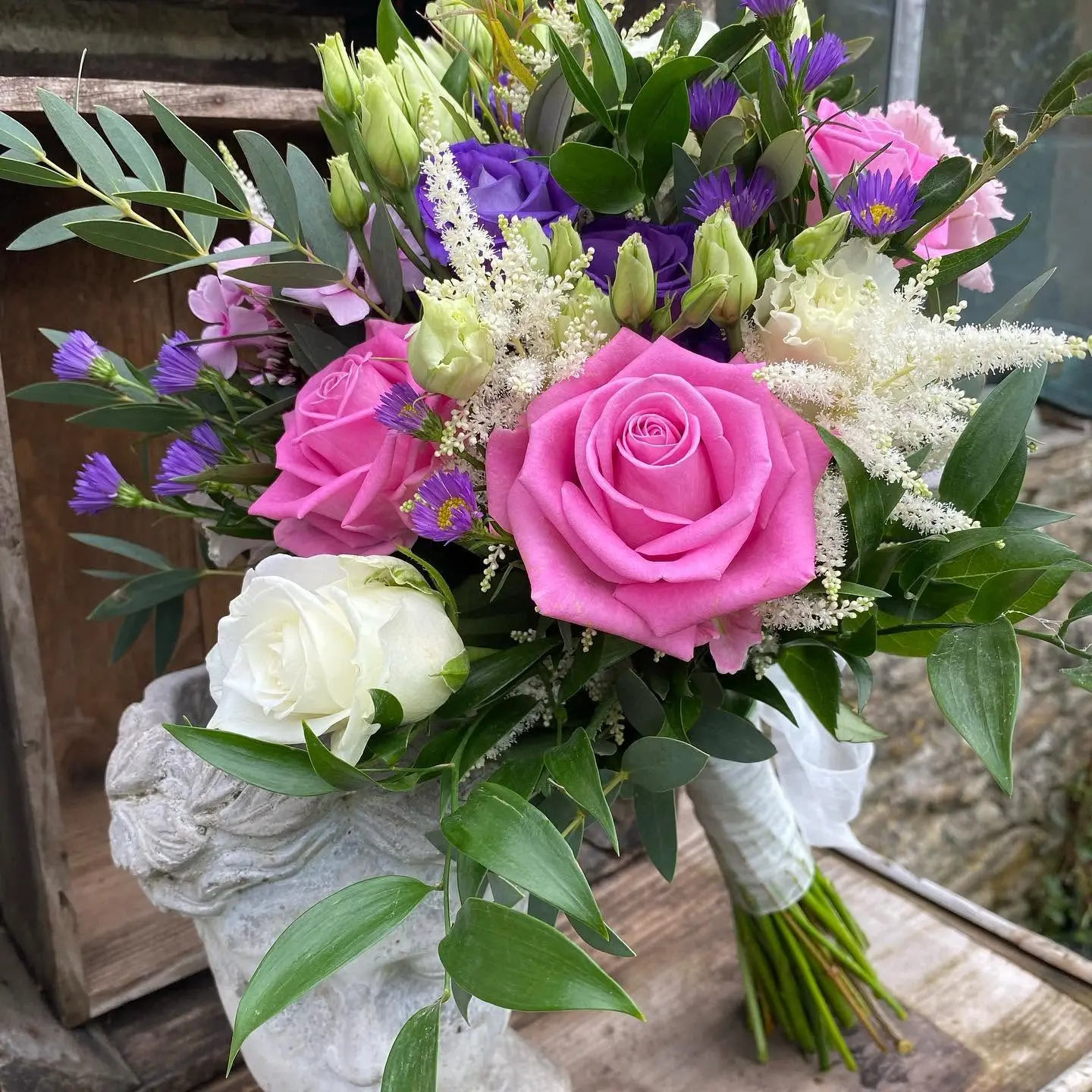 Vibrant pink, purple and white hand-tied bouquet