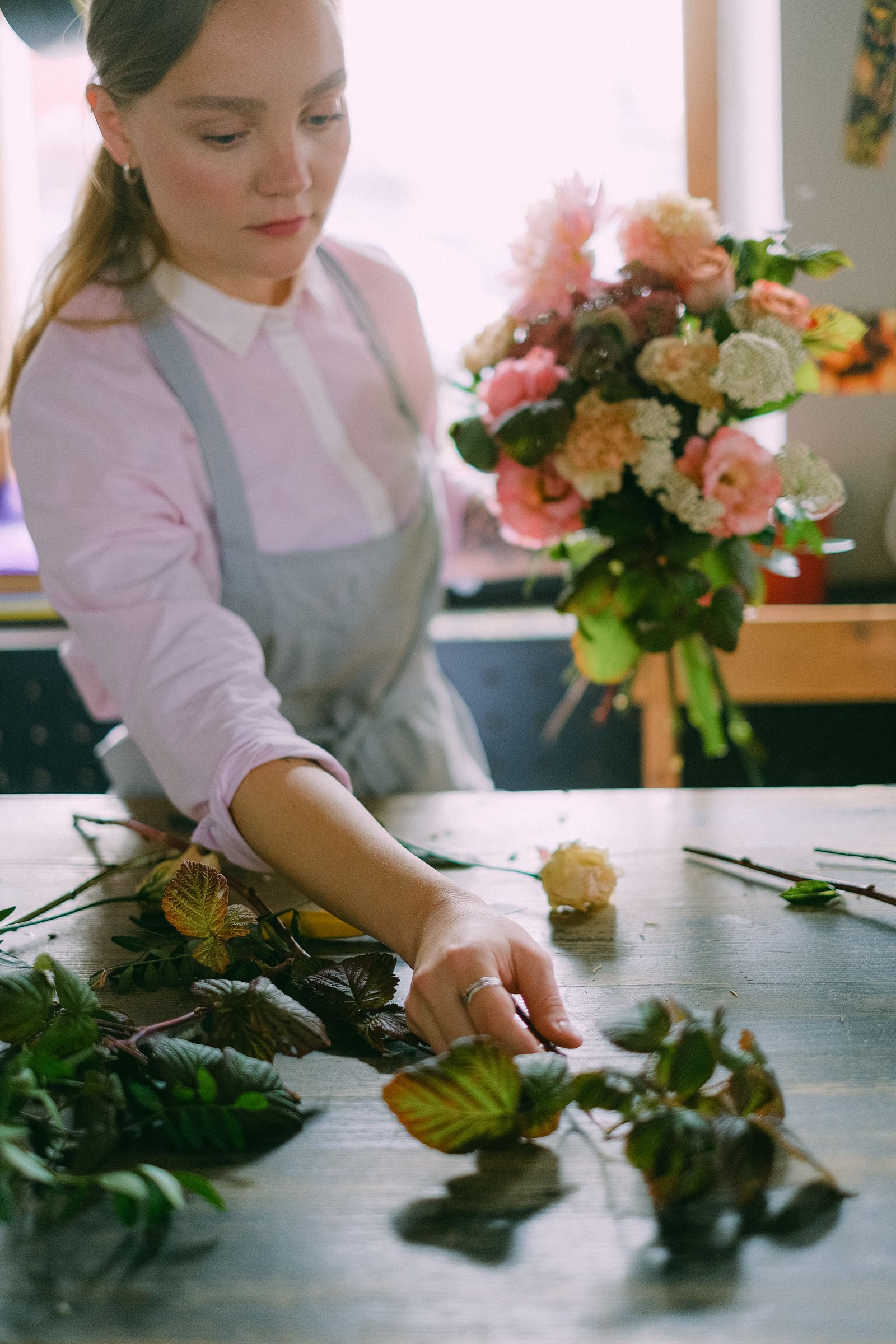 Florist arranging a handmade bouquet