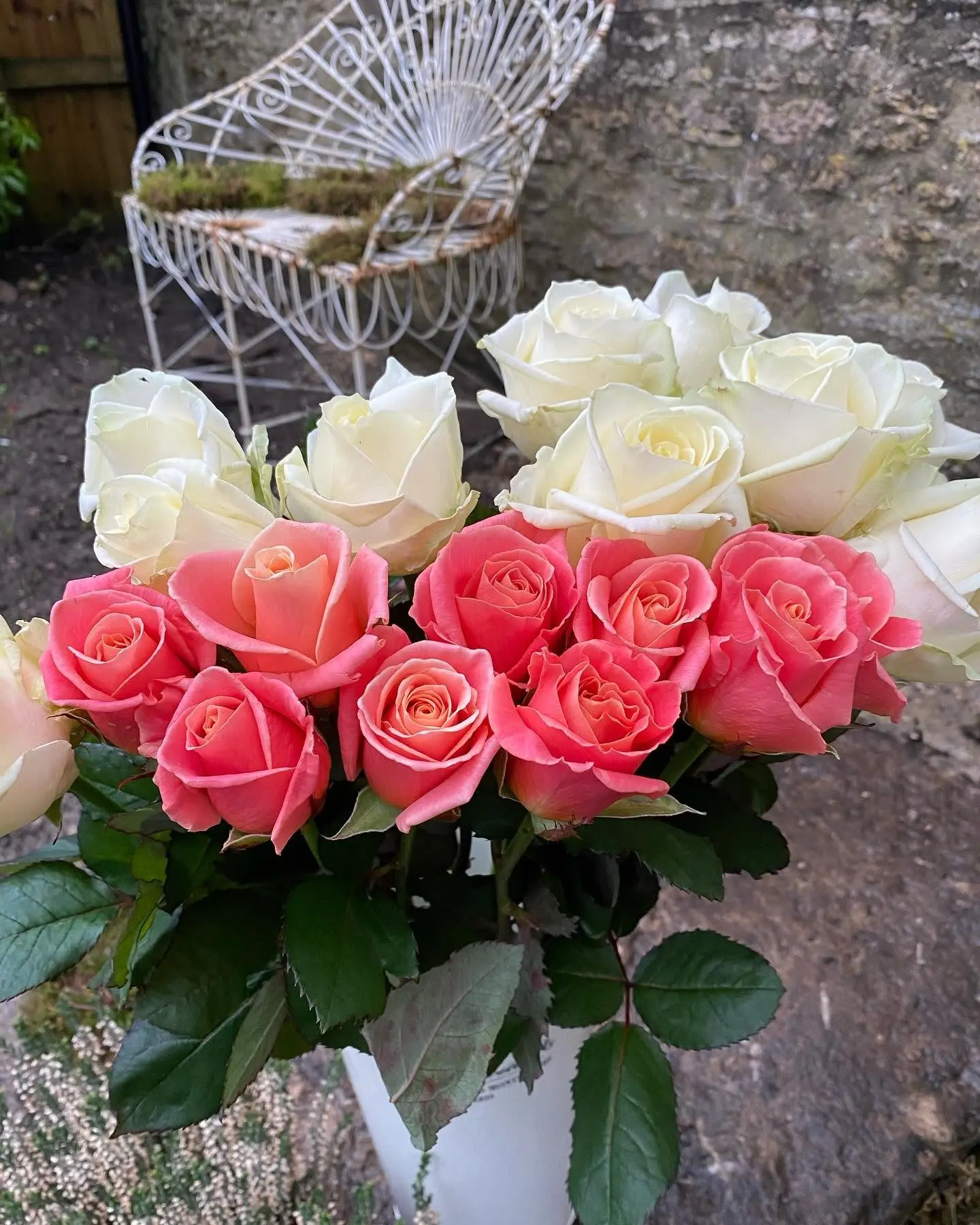 Coral pink and white rose arrangement