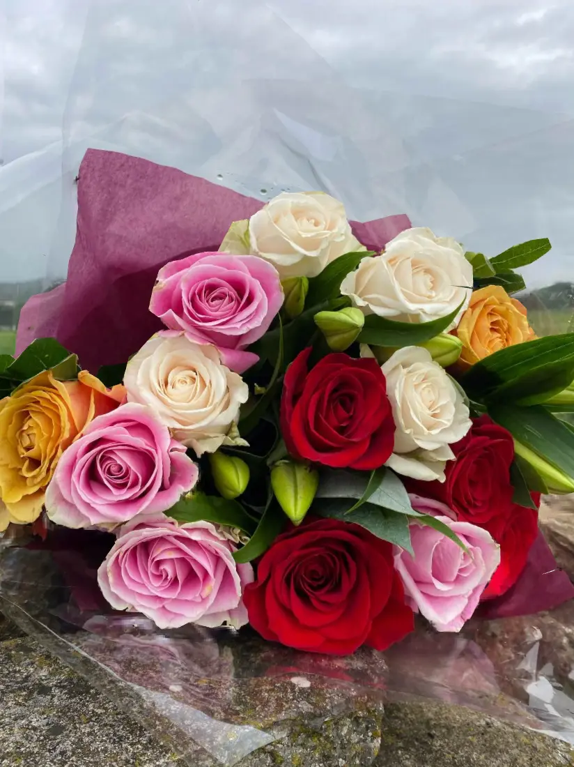 Mixed pink, red, cream and peach rose bouquet